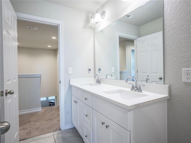 245 Tulum Ter, Leander, TX 78641 - full bath featuring double vanity and tile patterned flooring