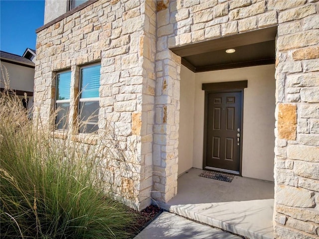 245 Tulum Ter, Leander, TX 78641 - entrance to property featuring stone siding