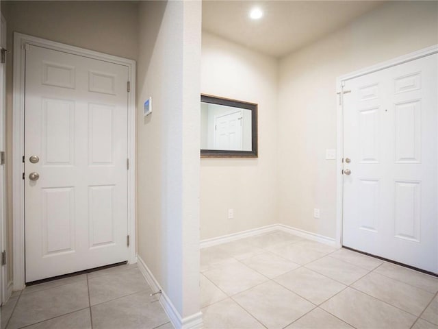 245 Tulum Ter, Leander, TX 78641 - entryway with light tile patterned floors and recessed lighting