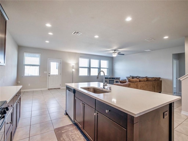 245 Tulum Ter, Leander, TX 78641 - kitchen featuring stainless steel appliances, recessed lighting, ceiling fan, light countertops, and dark brown cabinets