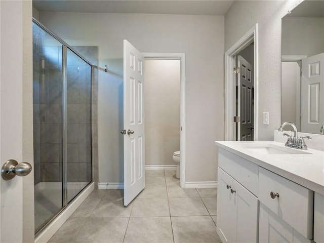 245 Tulum Ter, Leander, TX 78641 - full bathroom featuring vanity, a stall shower, and tile patterned floors