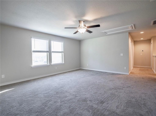 245 Tulum Ter, Leander, TX 78641 - unfurnished room featuring attic access, ceiling fan, a textured ceiling, and carpet