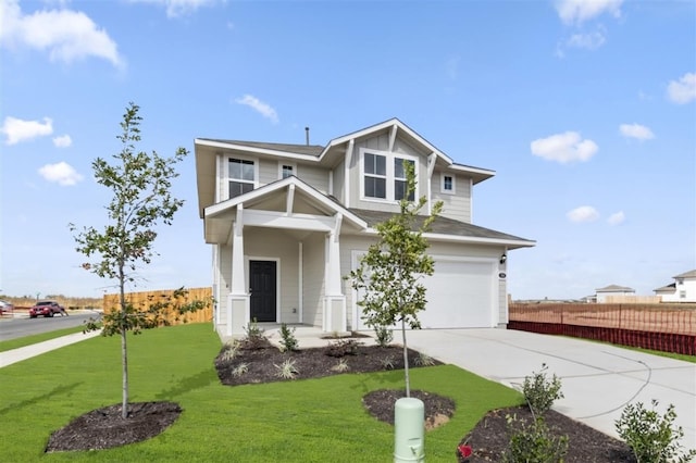 view of front of house featuring a front yard and a garage