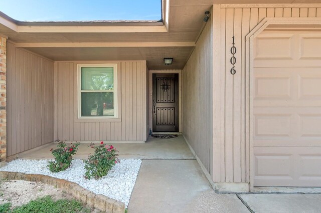 property entrance with a garage