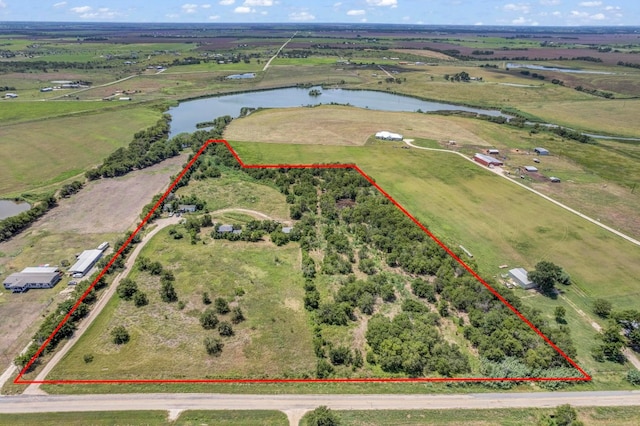 birds eye view of property with a water view and a rural view