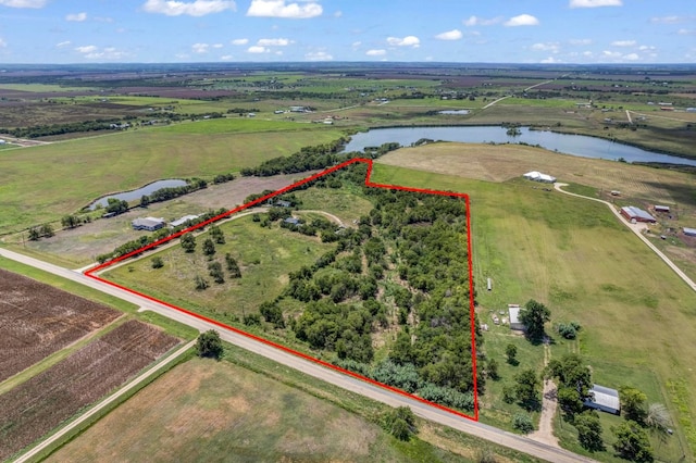 bird's eye view featuring a water view and a rural view