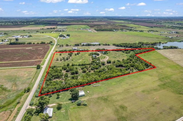 birds eye view of property with a rural view