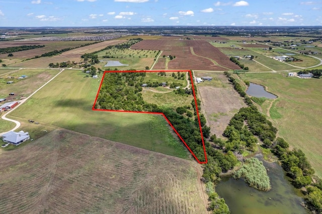 drone / aerial view featuring a water view and a rural view