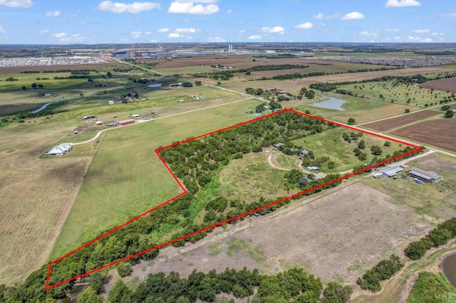 drone / aerial view with a water view and a rural view