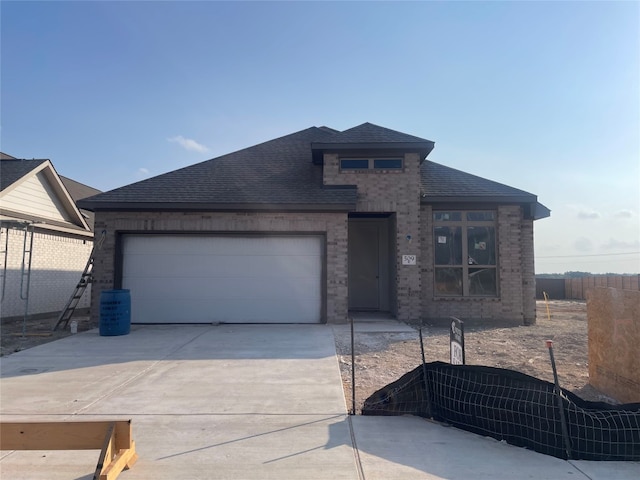 prairie-style house featuring a garage