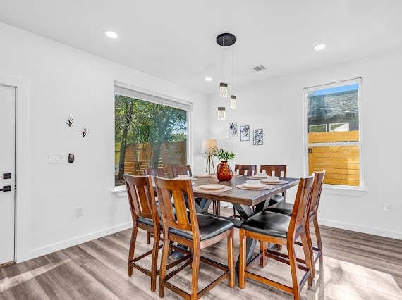 dining space featuring light wood-type flooring