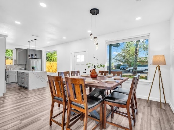 dining space featuring light hardwood / wood-style flooring