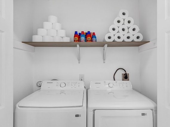 washroom with washer and dryer