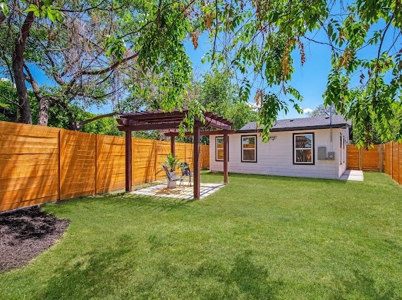 view of yard with a pergola and a patio