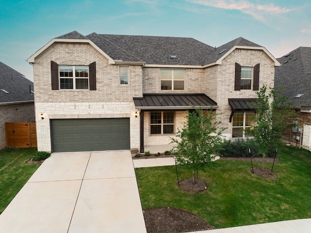 view of front facade featuring a front lawn and a garage