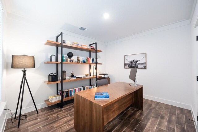 office with ornamental molding and dark hardwood / wood-style flooring