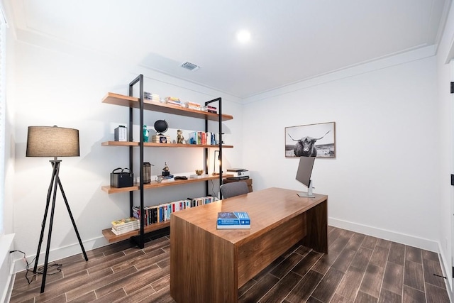 home office with ornamental molding, wood finish floors, visible vents, and baseboards