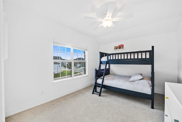 carpeted bedroom featuring lofted ceiling and ceiling fan