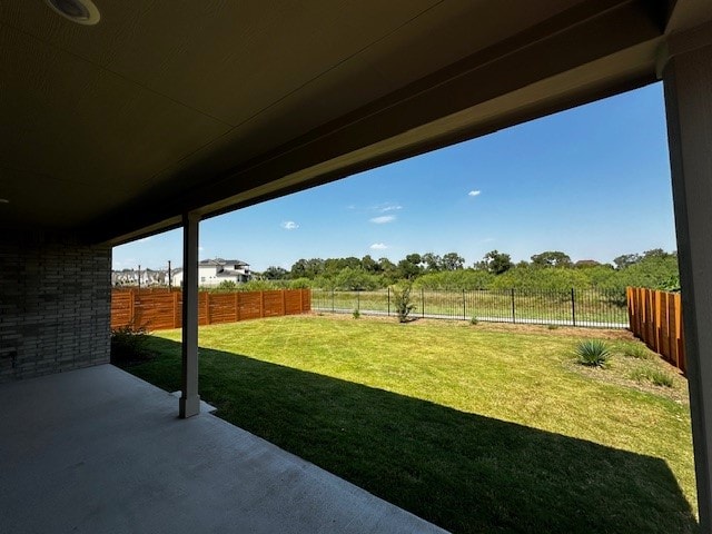 view of yard featuring a rural view and a patio