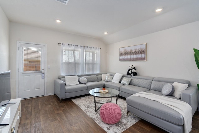 living room with lofted ceiling and dark wood-type flooring