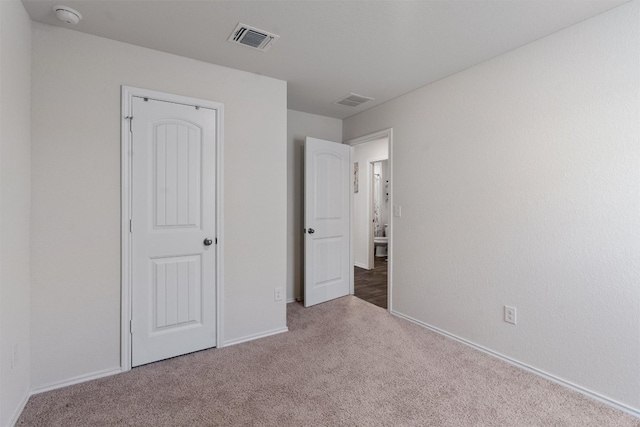 unfurnished bedroom with carpet floors