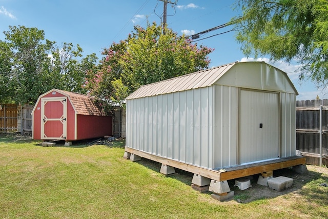 view of outbuilding with a yard