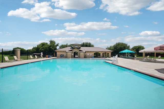 view of swimming pool featuring a patio