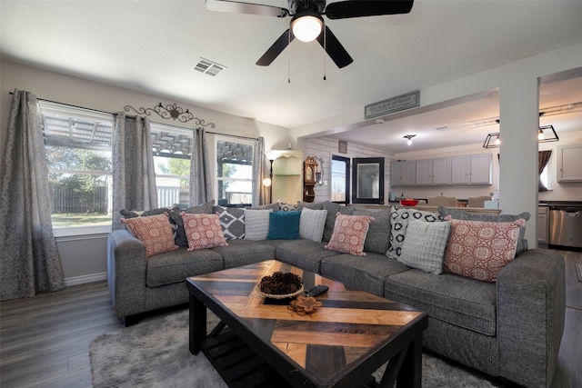 living room with ceiling fan and hardwood / wood-style flooring