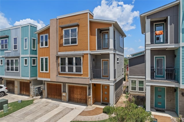 view of front of property featuring a balcony and a garage