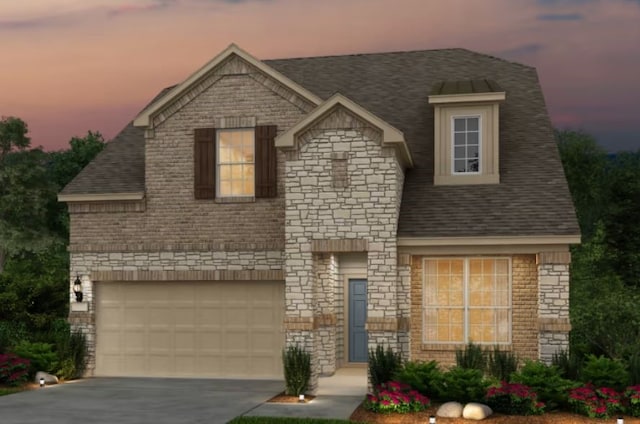 view of front of home with a garage