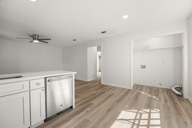 clothes washing area featuring sink, light hardwood / wood-style flooring, and ceiling fan