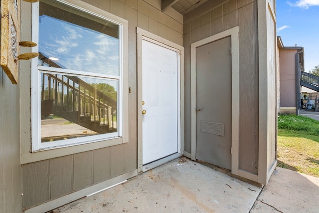 property entrance with a patio