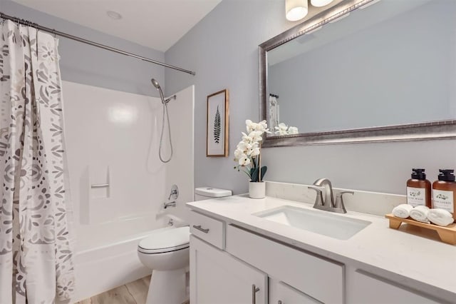 full bathroom featuring shower / bath combo, vanity, hardwood / wood-style flooring, and toilet