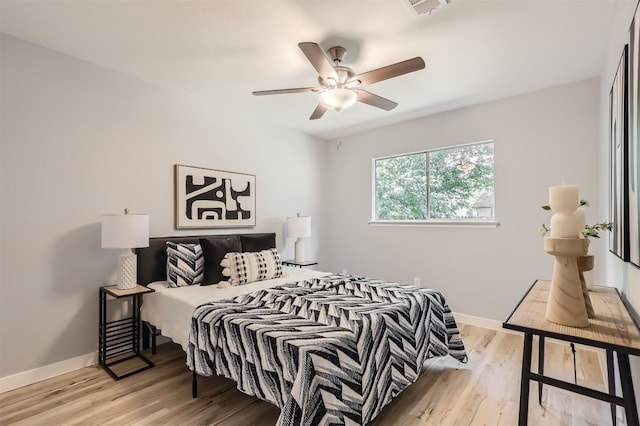 bedroom featuring ceiling fan and light hardwood / wood-style floors