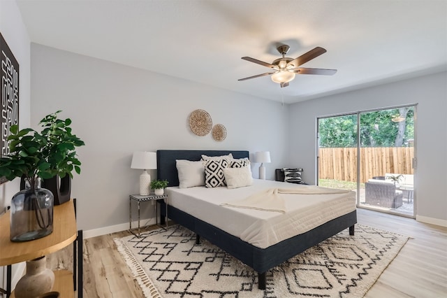 bedroom featuring ceiling fan, light wood-type flooring, and access to outside