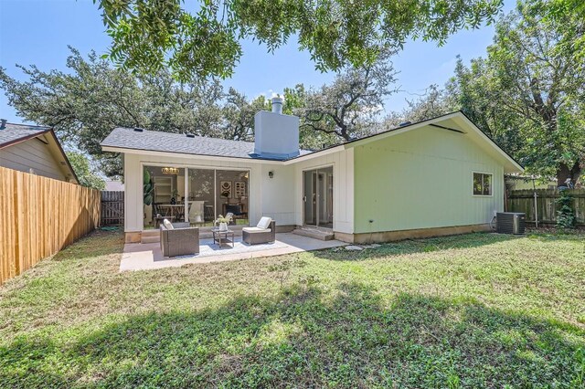 rear view of house with a lawn, central AC unit, an outdoor hangout area, and a patio