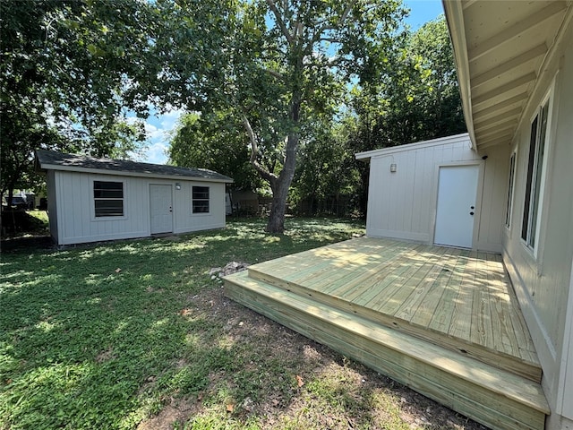 view of yard featuring an outbuilding and a deck