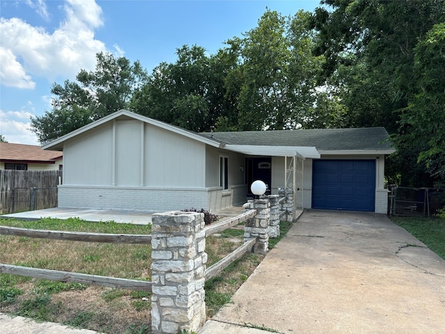 ranch-style home featuring a garage