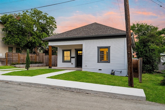 view of front of home featuring a yard