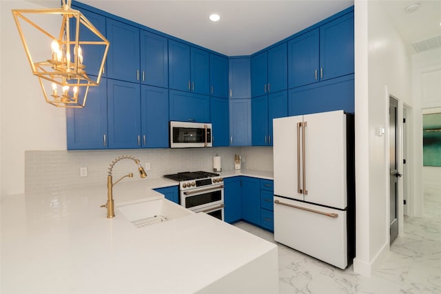 kitchen featuring light tile patterned floors, hanging light fixtures, decorative backsplash, premium appliances, and sink