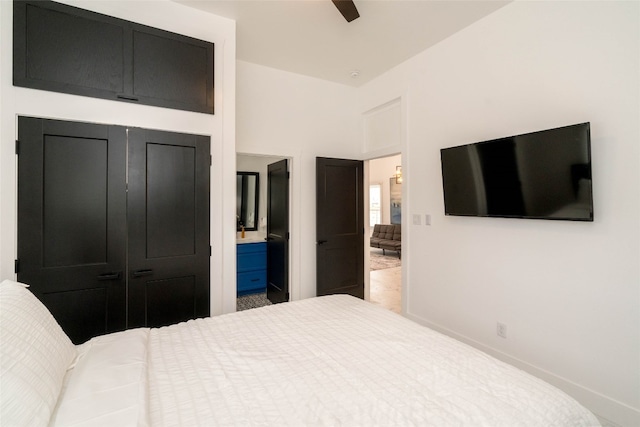 bedroom with connected bathroom, a closet, and ceiling fan