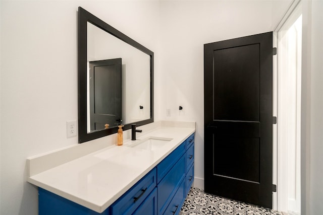 bathroom with vanity and tile patterned flooring