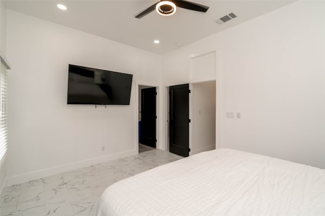 bedroom featuring ceiling fan and light tile patterned flooring