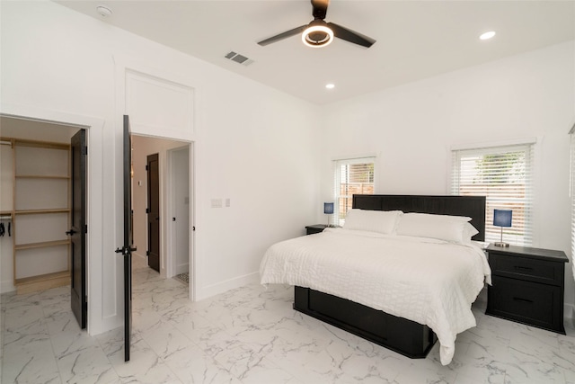 tiled bedroom with ceiling fan