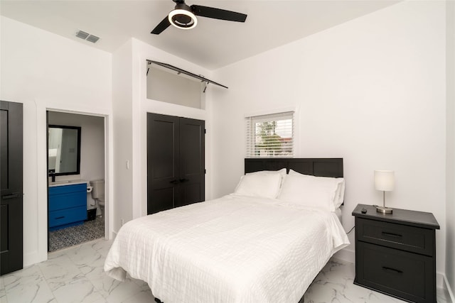 bedroom with ceiling fan and light tile patterned flooring