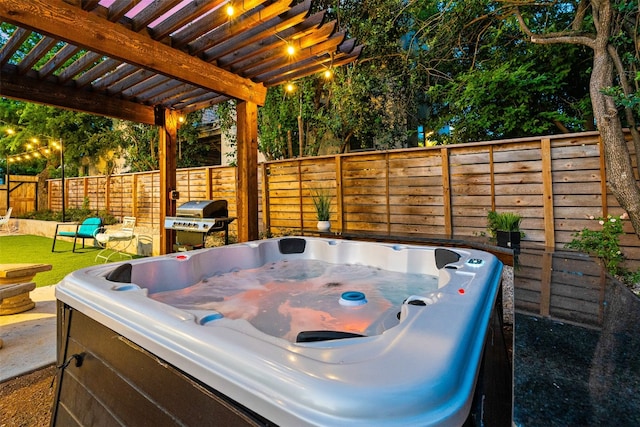 view of patio / terrace with a pergola, area for grilling, and a hot tub