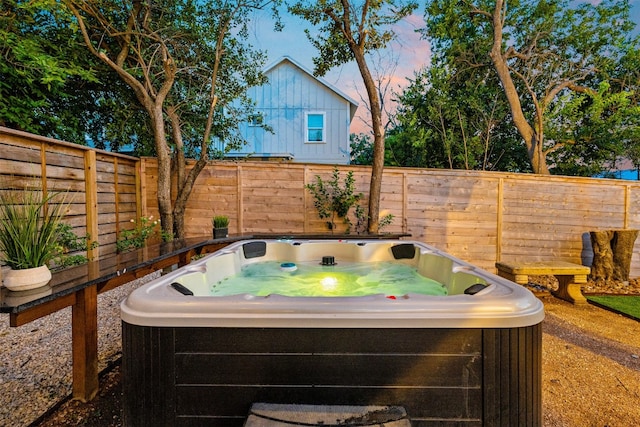 patio terrace at dusk with a hot tub