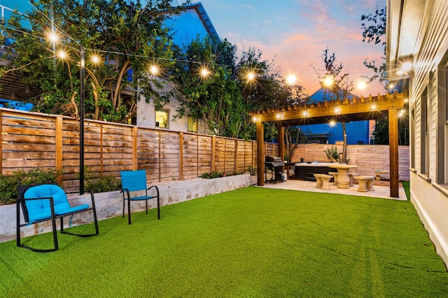 yard at dusk with a pergola and a patio area