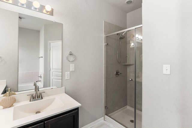 bathroom featuring vanity and walk in shower