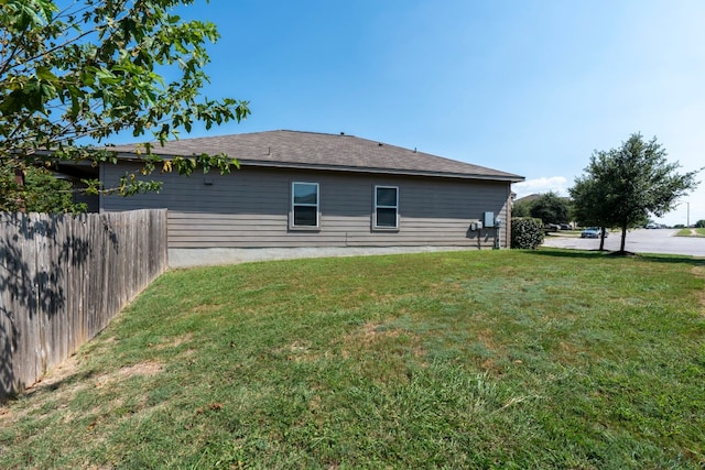 view of home's exterior featuring a yard